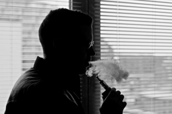 Vaping Man With Electronic Cigarette / E Cig / Vapouriser