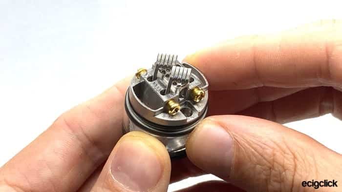 Showing two coils having been dropped into the Vandy Vape Pyro V3, they are at an angle as they have not been tightened or positioned yet
