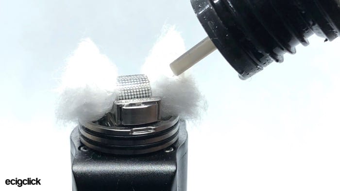 Applying e-liquid to the cotton on the Yachtvape RDA