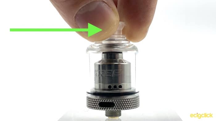 Unscrew Drip Tip Arrow To Show Sideways Direction to Apply Pressure