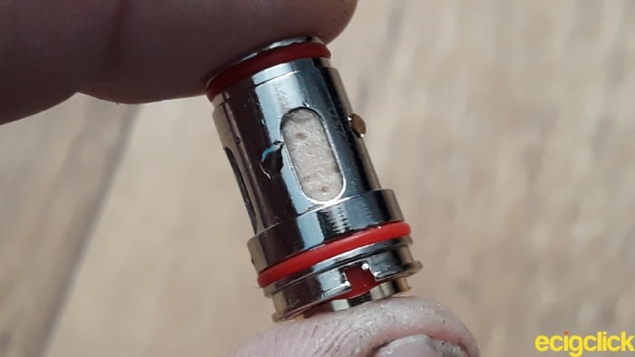 Uwell Crown 5 soaking the wicking ports prior to installation