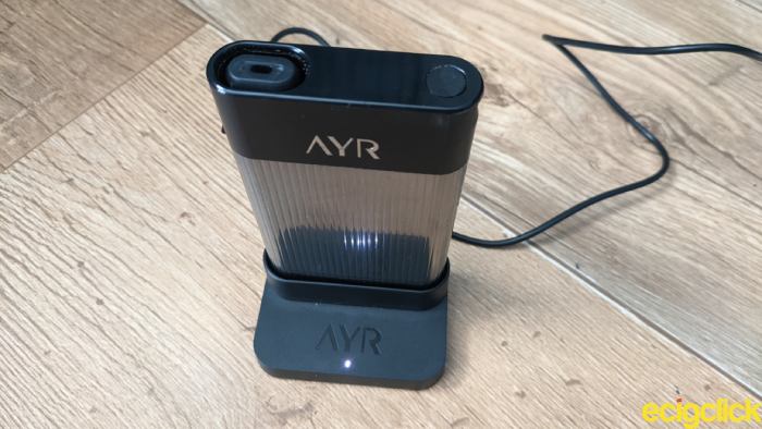 Ayr vape kit connecting the case to the dock for charging image
