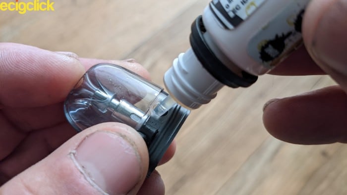 Filling the pod on the Voopoo Argus P1 pod kit