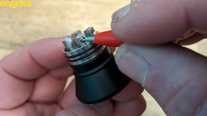 Unscrewing the grub screws of the Drop V2 RDA