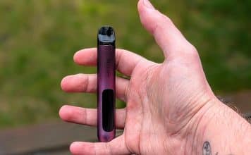 Geek Bar Spark Review- Sparking Up Your Pod System! geek bar spark in hand